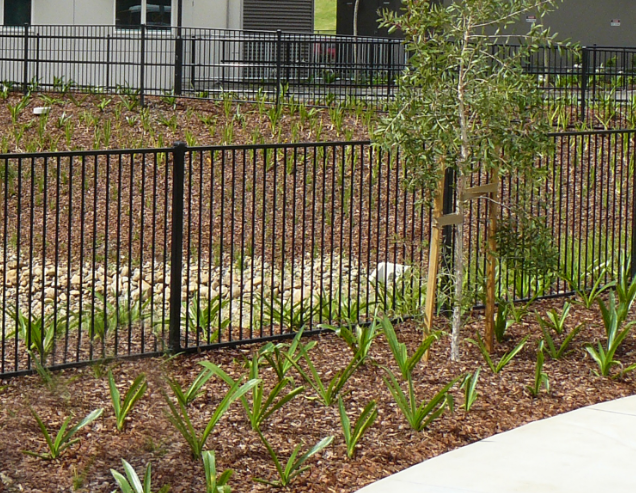 Architectural style Aluminium Fencing in front of a large apartment complex