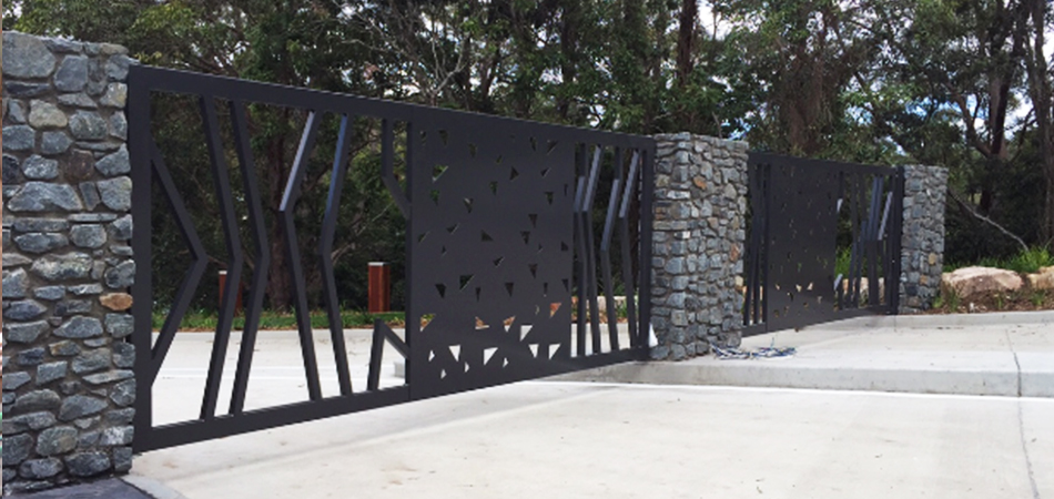 Two large swing entry gates with laser cut designs