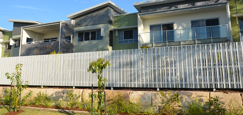 Architectural style Aluminium Fencing in front of a large apartment complex