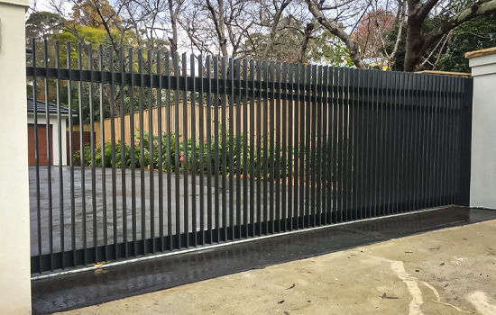 Aluminium Batten style Sliding Gate securing a property driveway