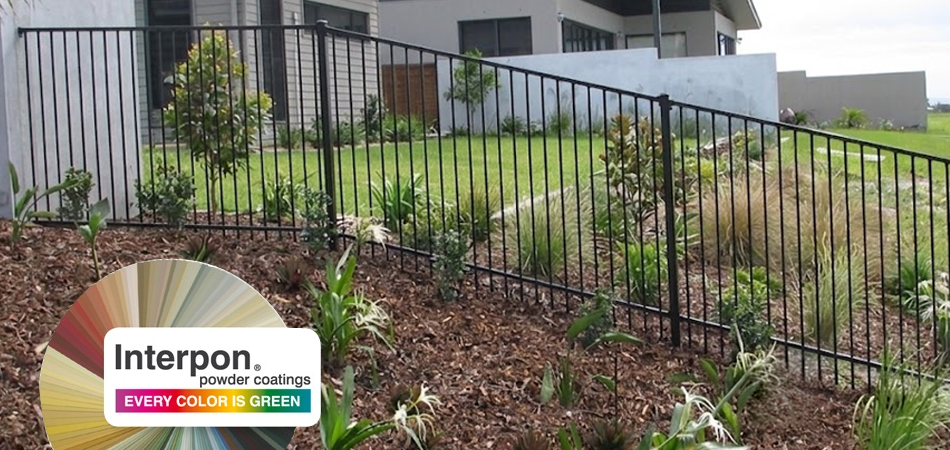 House with a raked black Powder Coated custom Aluminium garden fence surrounding the yard