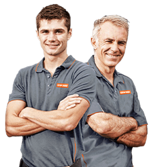 Two Oxworks staff members folding their arms and smiling.