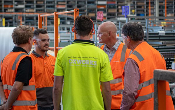 Oxworks staff conducting an manufacturing tour for visitors