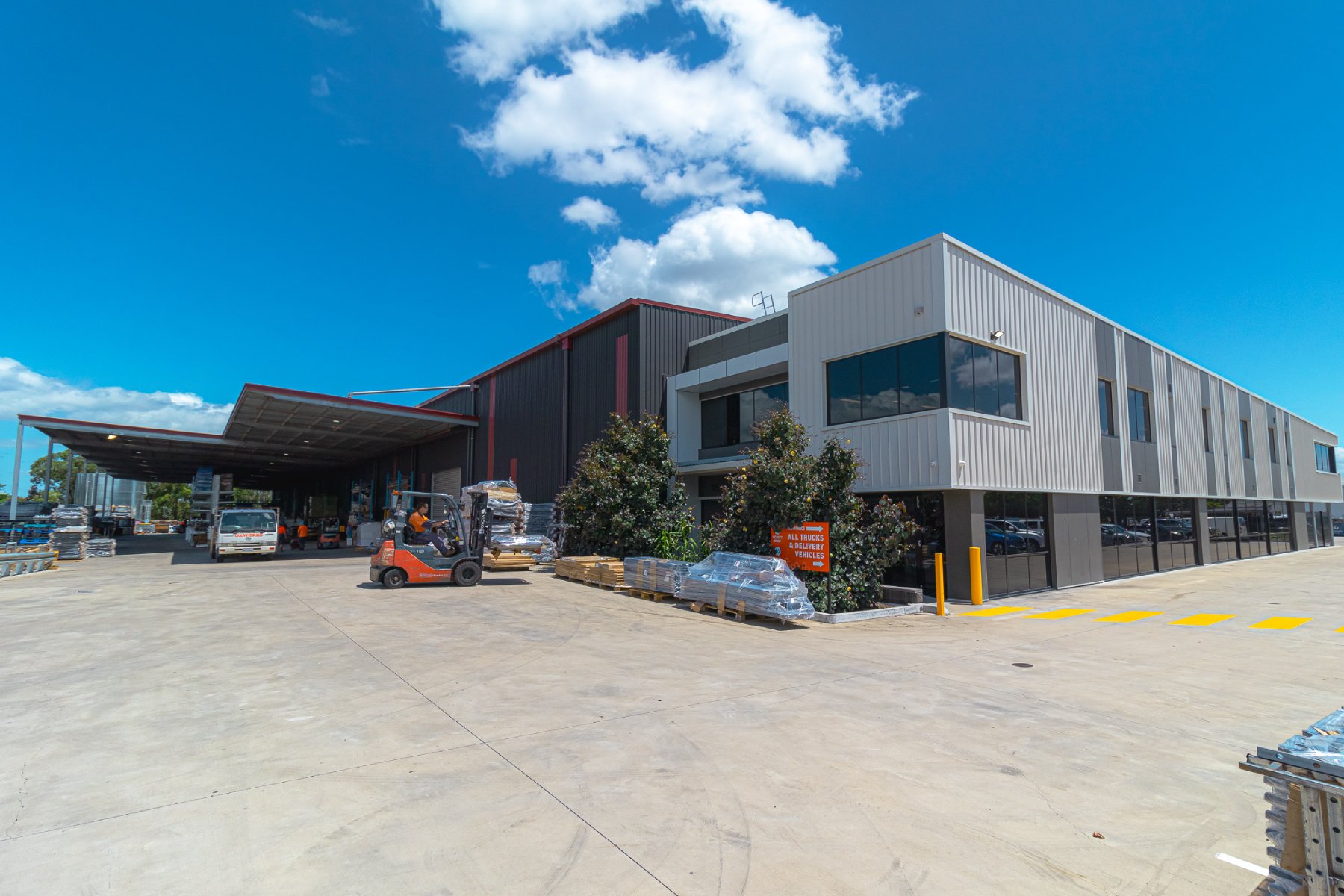 Forklift operator moving stock in front of Oxworks manufacturing facility